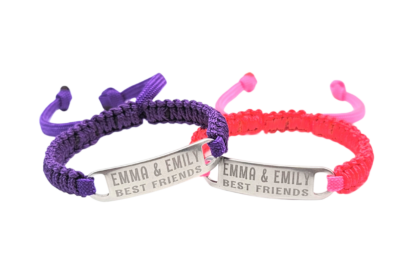 Studio shot of the purple and pink best friends bracelets with "Emma & Emily Best Friends" engraved, displayed side by side against a white background.
