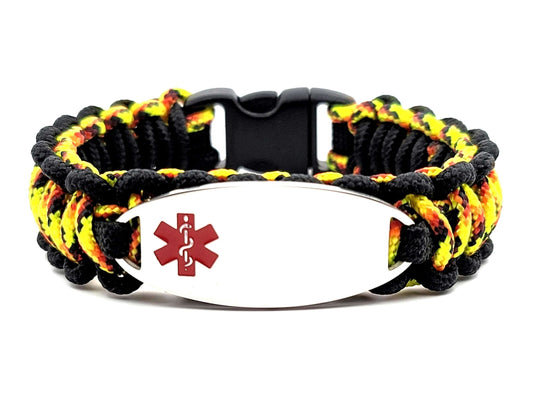 Yellow, black & red, thin, 275 paracord medical alert bracelet with a silver colored, stainless steel ID tag with an enameled red medical symbol, displayed on a white background.