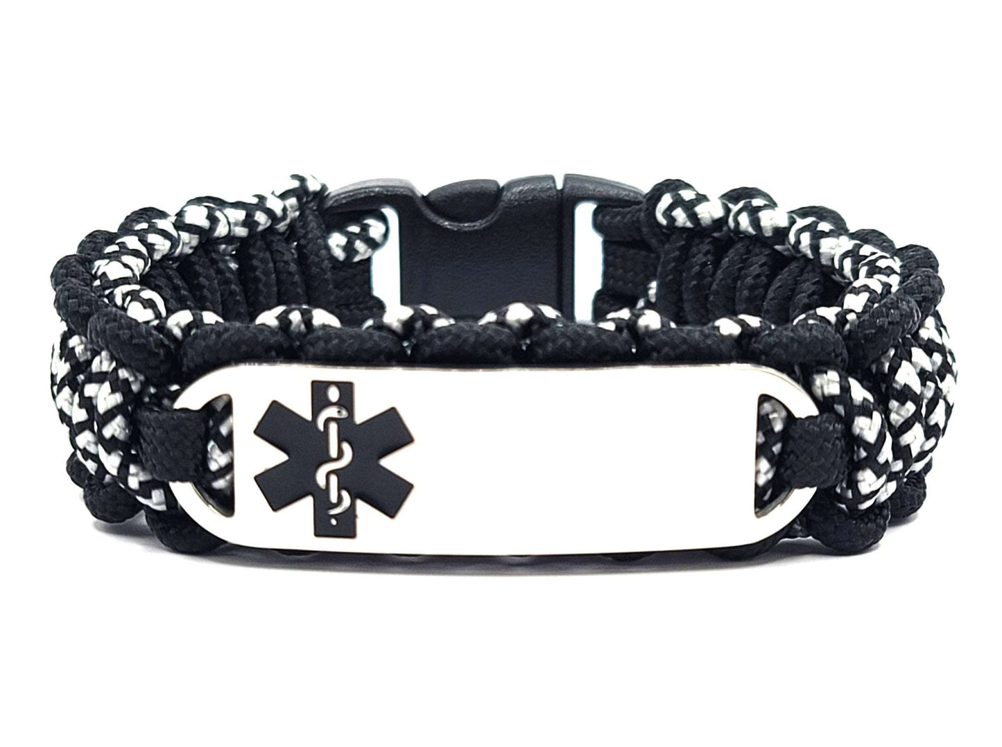 Black and silver, thin, 275 paracord medical alert bracelet with a silver colored, stainless steel ID tag with an enameled black medical symbol, displayed on a white background.