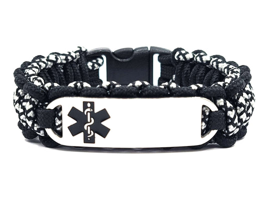 Black and silver, thin, 275 paracord medical alert bracelet with a silver colored, stainless steel ID tag with an enameled black medical symbol, displayed on a white background.