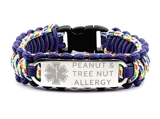 Colorful thin 275 paracord ID bracelet with a silver, stainless steel ID tag engraved with medical information and a medical symbol, displayed on a white background.