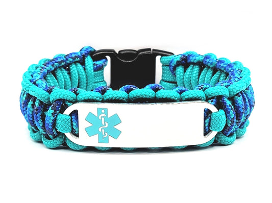 Teal & blue, thin, 275 paracord medical alert bracelet with a silver colored, stainless steel ID tag with an enameled teal medical symbol, displayed on a white background.