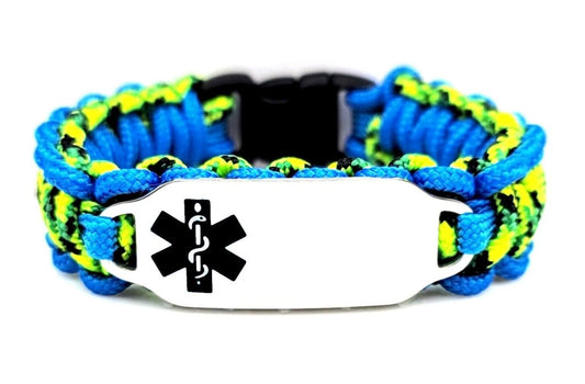 Black, Blue, & neon green, thin, 275 paracord medical alert bracelet with a silver colored, stainless steel ID tag with an enameled black medical symbol, displayed on a white background.