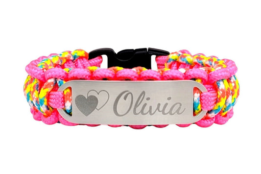 A brightly colored thin 275 paracord ID bracelet with a silver, stainless steel ID tag engraved Olivia and a symbol with 2 hearts, displayed on a white background.