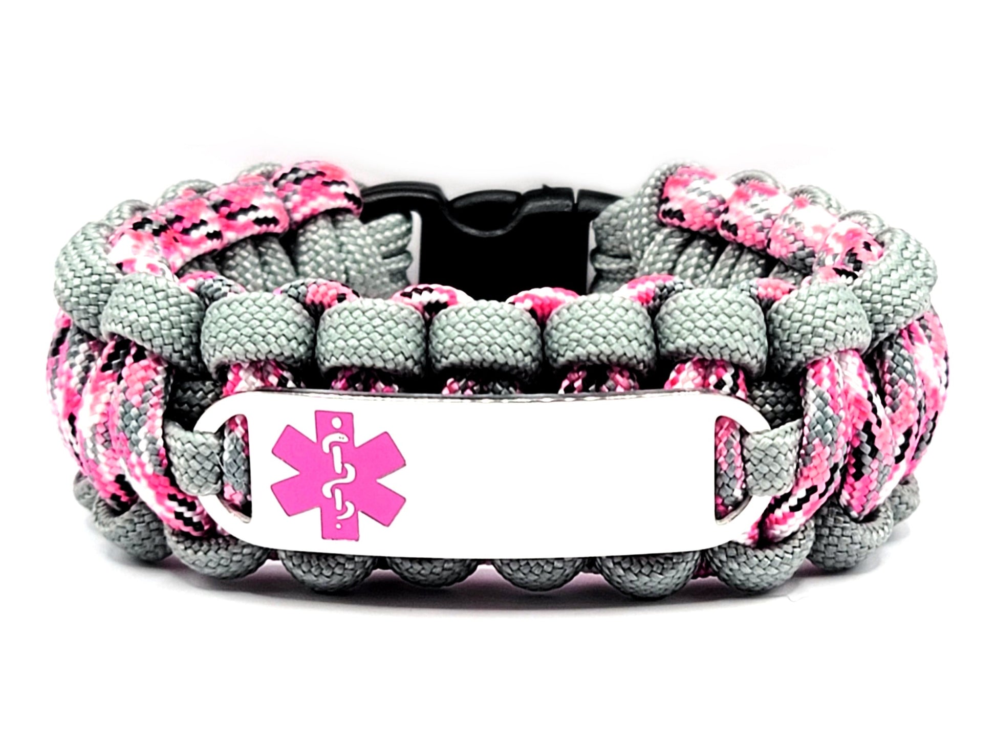Pink, grey, and black paracord medical alert bracelet with a silver colored, stainless steel ID tag with an enameled pink medical symbol, displayed on a white background.