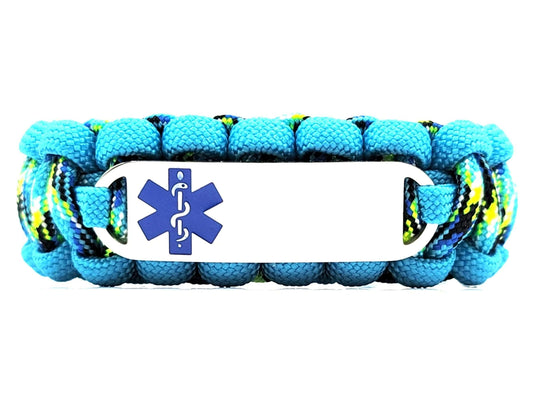 Turquoise, black, blue and yellow paracord medical alert bracelet with a silver colored, stainless steel ID tag with an enameled blue medical symbol, displayed on a white background.