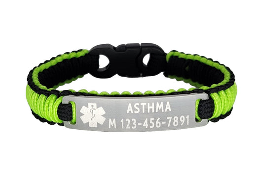 A neon green and black micro cord bracelet with an engraved tag that reads Asthma and a phone number showing its adjustable design against a seamless white background.