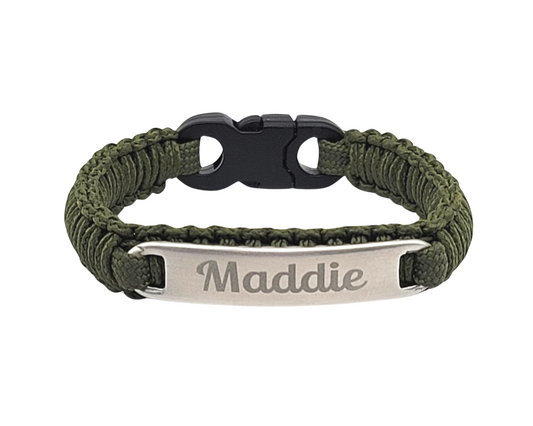 Olive Drab green micro cord bracelet featuring a stainless steel tag engraved with the name Maddie, paired with a durable black plastic buckle. The minimalist and practical design is displayed on a plain white background.