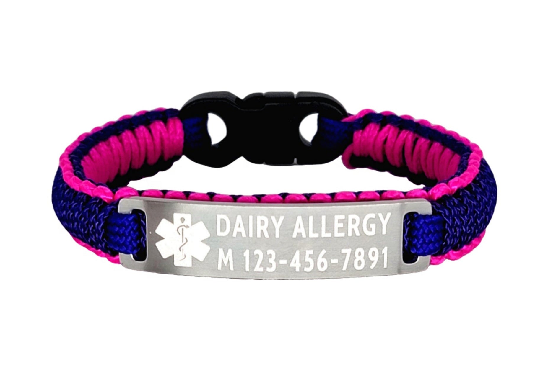 A pink and purple micro cord bracelet with an engraved metal tag that reads Dairy Allergy and a phone number displayed against a plain white background.