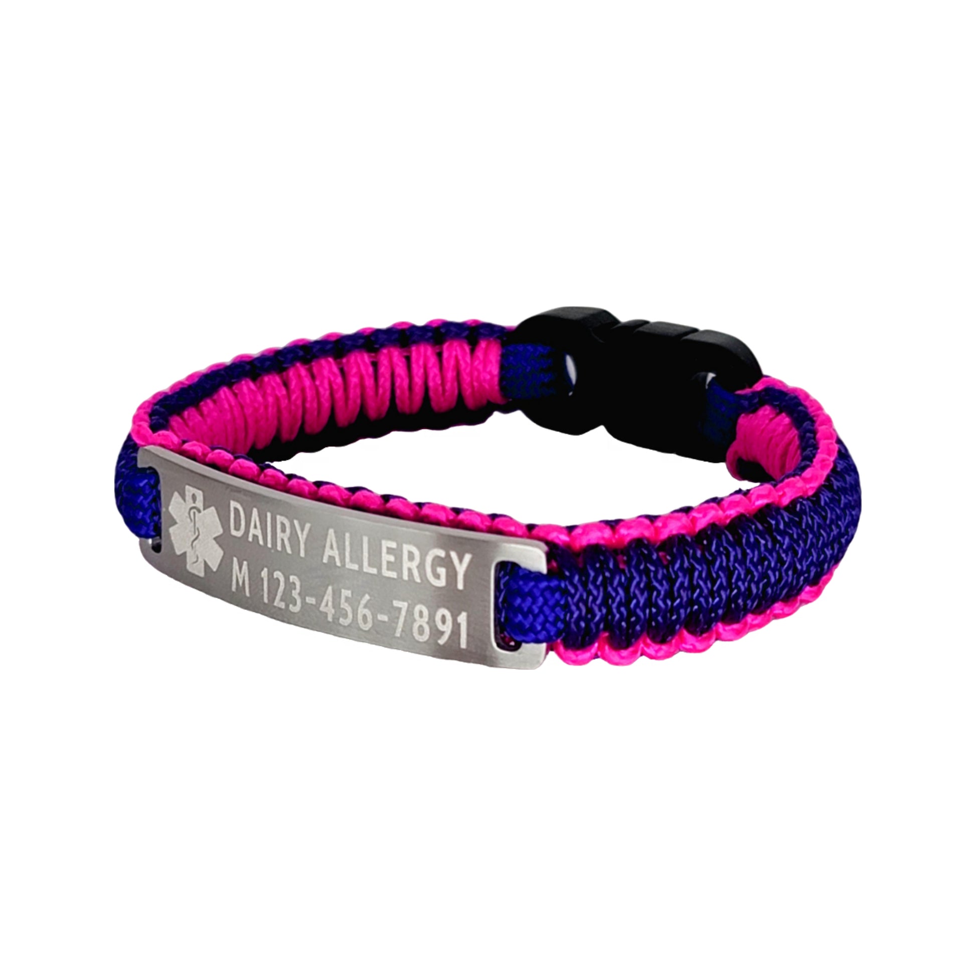 A side view of a pink and purple micro cord bracelet showing its adjustable design with the engraved tag that says Dairy Allergy and a phone number set against a seamless white background.
