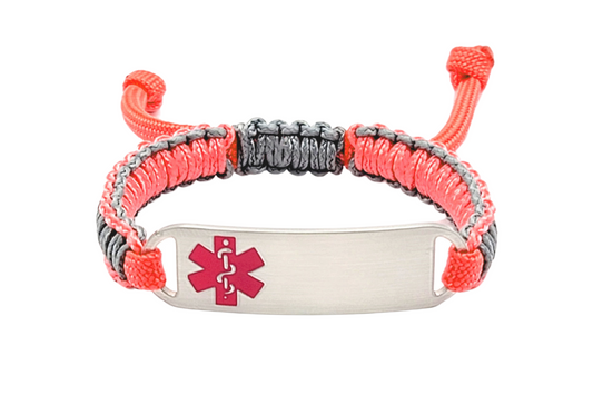 Adjustable micro paracord medical ID bracelet on a white background. Features a pink and gray cord with a polished silver tag engraved with a pink medical alert symbol, showcasing its durable design and customizable fit.