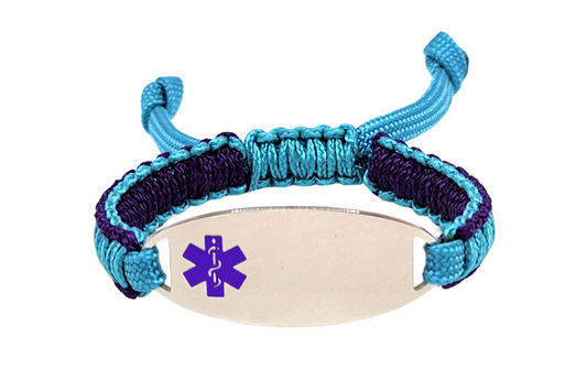 An adjustable micro paracord bracelet displayed on a white background. The bracelet has a polished silver oval tag engraved with a purple medical alert symbol and a paracord design in teal and purple.