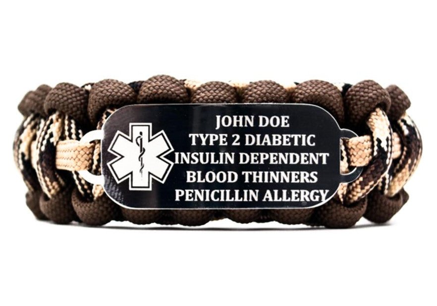550 paracord bracelet with multiple shades of brown on a white background. The stainless steel ID tag on the bracelet features an engraved medical alert symbol; along with five lines of medical info.