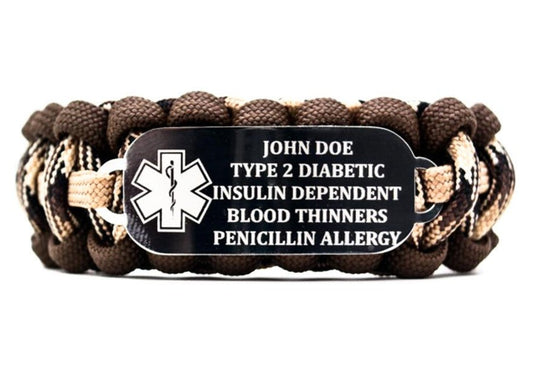 550 paracord bracelet with multiple shades of brown on a white background. The stainless steel ID tag on the bracelet features an engraved medical alert symbol; along with five lines of medical info.