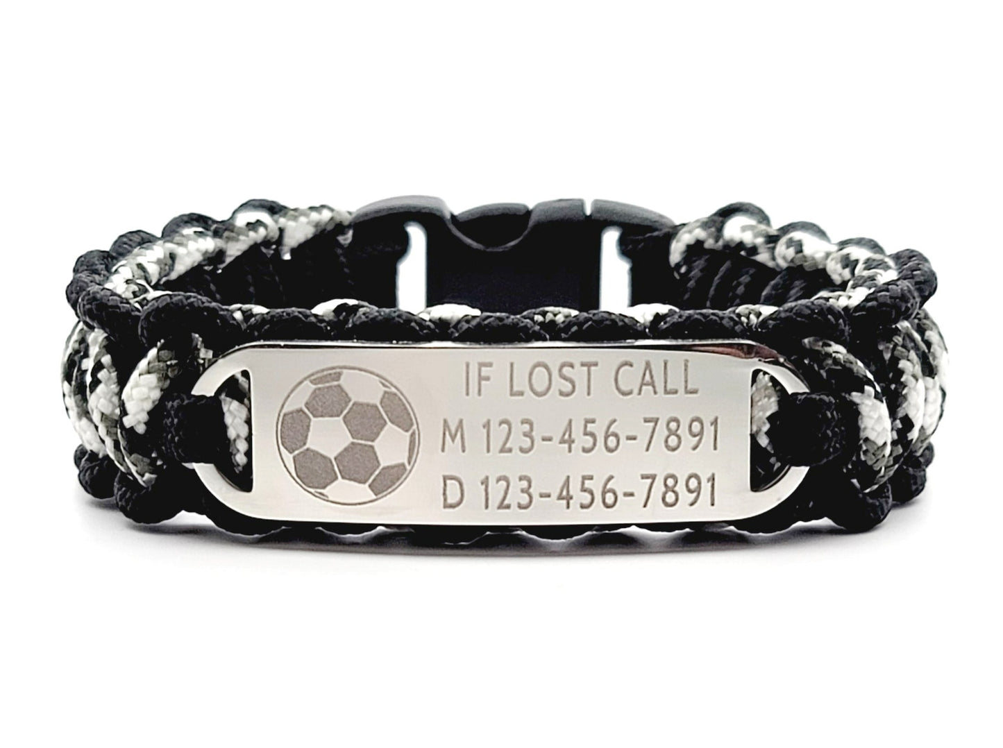 Black, white, & grey thin 275 paracord ID bracelet with a silver, stainless steel ID tag engraved with emergency contact information and a soccer symbol, displayed on a white background.