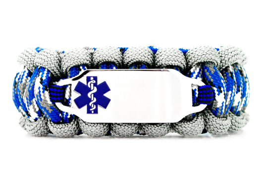 Grey and blue camo paracord medical alert bracelet with a silver colored, stainless steel ID tag with an enameled blue medical symbol, displayed on a white background.