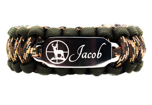 Camouflage paracord ID bracelet with a silver, stainless steel ID tag engraved with the name Jacob and a deer silhouette, displayed on a white background.