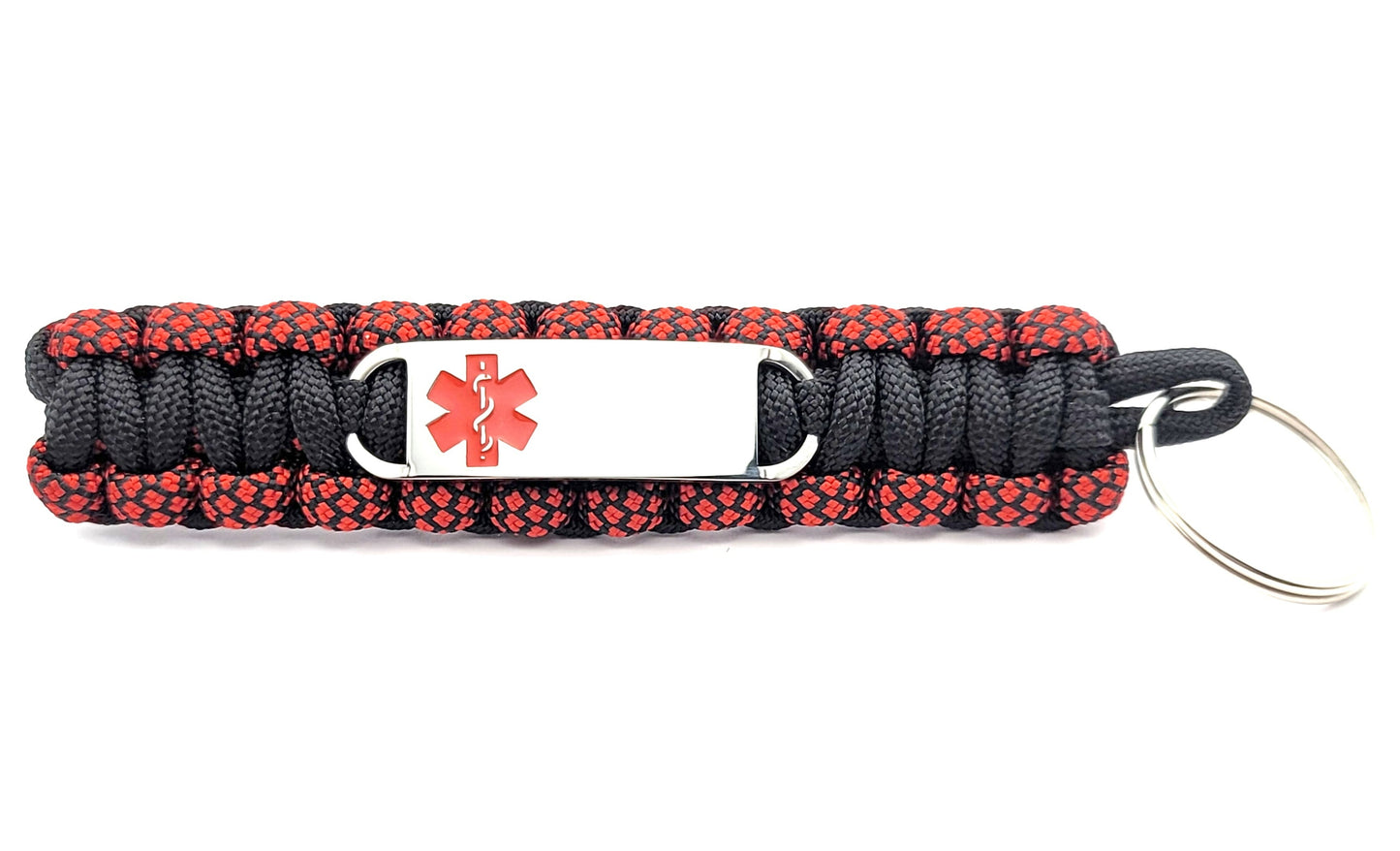 Black and red paracord medical ID keychain with a silver, stainless steel ID tag with a red enameled medical symbol, displayed on a white background.